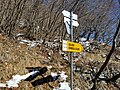 Guidepost at the junction with the ex military road to Monte di Tremezzo, directions towards Grandola ed Uniti