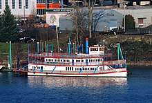 The sternwheeler MV Columbia Gorge, a 1983 diesel-powered replica steamboat, operates on the Willamette River in non-summer months. Sternwheeler Columbia Gorge in 2013, moored near OMSI in Portland.jpg