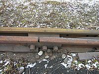 A light industrial or yard track switch joint, where the points are joined to the closure rails by bolts through a "joint bar" or "fish plates"