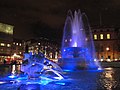 The Trafalgar Square fountain, Westminster (borough), London, seen illuminated at night in December 2011.