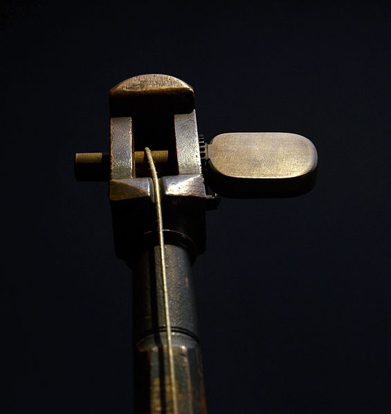 The single tuning peg of a tromba marina, turned by hand
