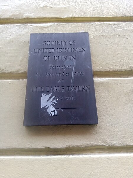 Plaque on the wall of the former Eagle Tavern