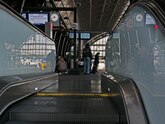 View from the escalator over the train platform in Central Station Amsterdam; free photo, Fons Heijnsbroek, 11 April 2022