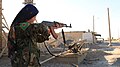 YPJ soldier takes aim with her rifle.jpg