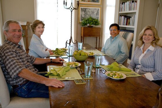 Gonzales and his wife Rebecca, with George W. Bush and Laura Bush at the Prairie Chapel Ranch on August 26, 2007, the day that Gonzales's resignation 