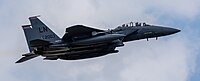 An F-15E Strike Eagle, tail number 01-2003, taking off from RAF Lakenheath in England. The aircraft is assigned to the 494th Fighter Squadron.