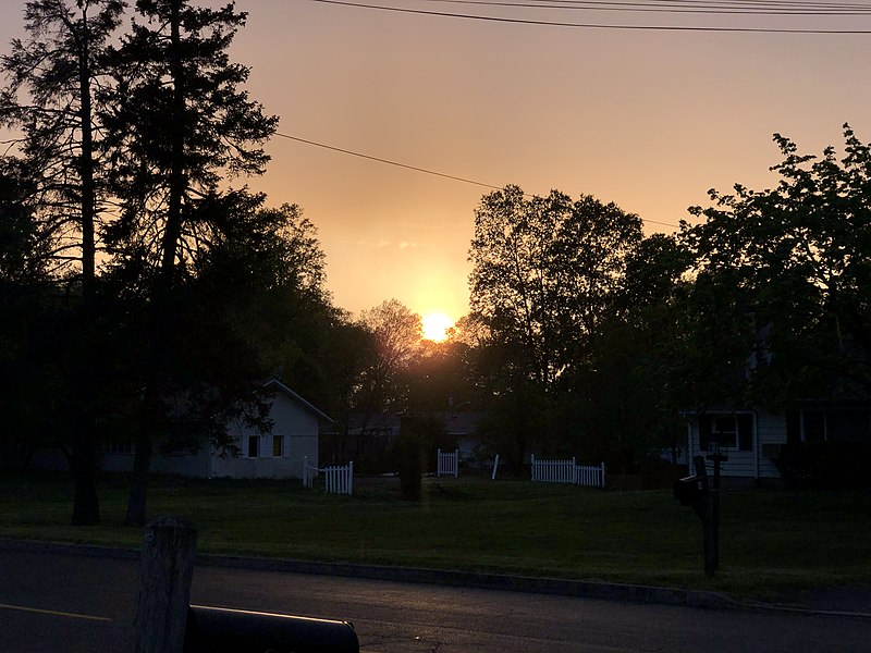 File:2023-04-26 19 22 10 The sun peaking beneath a layer of clouds during a rain shower near sunset along Mountain View Road in the Mountainview section of Ewing Township, Mercer County, New Jersey.jpg