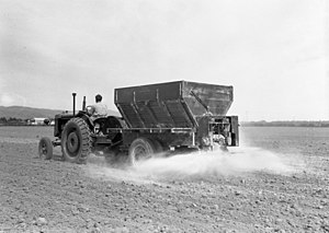 A bulk lime spreader operating at Canterbury Agricultural College, 1949 7251 Lincoln College farm.jpg