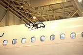 Donecle's autonomous UAV inspecting an aircraft. AFI 05 2017 Donecle drone 002.jpg