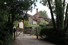 A gate and house at Theydon Mount Essex England.JPG