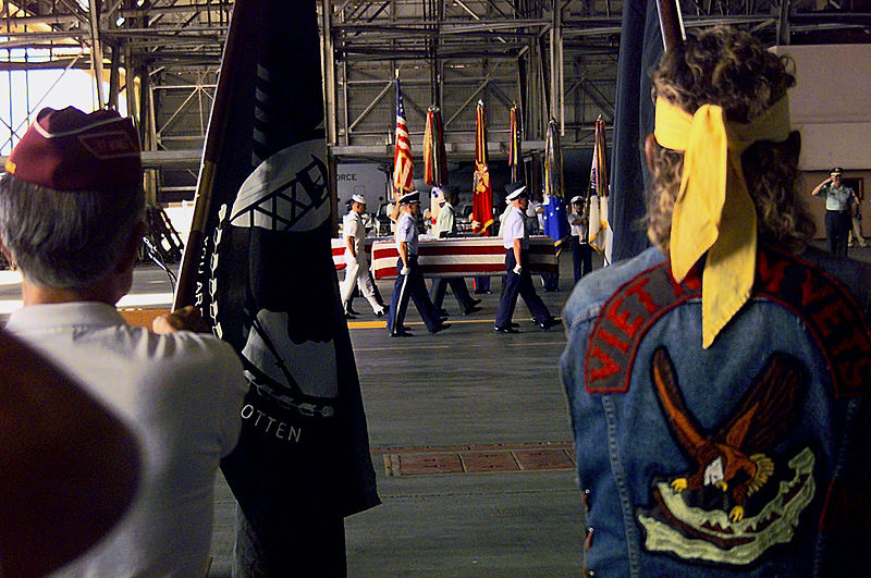 File:A joint services honor guard carries a casket toward an awaiting bus on September 15, 2000 000829-F-QT350-003.jpg