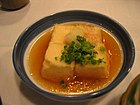 Agedashi tofu: fried tofu in tsuyu sauce, often topped with bonito flakes that is often served as an appetizer