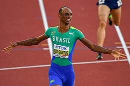 Dos Santos celebrates his victory at the 2022 World Athletics Championships held in Eugene, Oregon. Alison dos Santos Oregon 2022.jpg