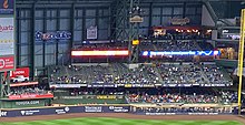 The outfield pitch clock at American Family Field is seen in the center of the image on the pillar in September 2022; here, it indicates that seven seconds remain in a television timeout between innings. American Family Field Pitch Clock.jpg