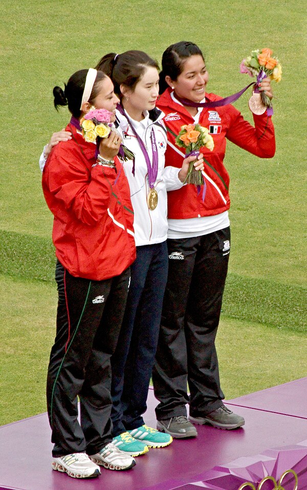 Ki Bo-bae (centre), Aída Román (left), and Mariana Avitia (right) during the medal presentation ceremony.