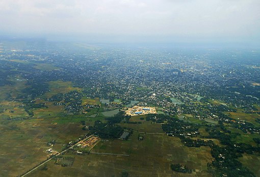 Aerial view of Agartala, mainly showing the parts of Ramnagar and the Integrated Check Post (ICP) (white landmark). Beyond that point is the Indo-Bangla border showing the territory of Bangladesh (paddy field).