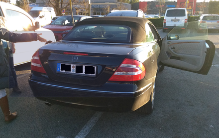 A driver has taken up two spaces in a parking lot