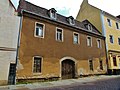 Residential house in closed development, with two side wings in the courtyard and rear building