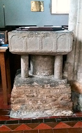 The baptismal font is 12th-century Norman Baptismal font St Peters Shirwell.jpg