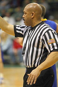 NCAA official Moe Kincaid making a call in a 2008 college basketball game Basketball official.jpg