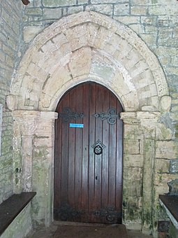 The doorway in the south porch, showing the decorated Norman arch Belchalwell Church 3.jpg