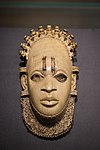 Pendant mask; by artists of the Edo people (Nigeria); 16th century (?); ivory and iron; height: 24.5 cm; British Museum, London[104]