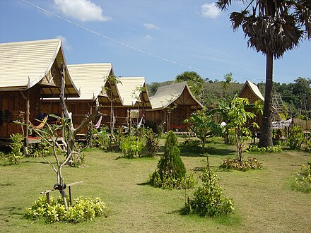 Basic wooden bungalows as found in cheaper resorts