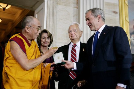The Dalai Lama receiving a Congressional Gold Medal in 2007. From left: Tenzin Gyatso, Speaker Nancy Pelosi, Senate President pro tempore Robert Byrd and U.S. President George W. Bush