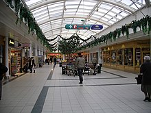 Cannon Park shopping centre - covered walkway with Christmas decorations in December 2007 Cannon park undercover shops 7d07.JPG