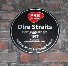 PRS for Music heritage plaque commemorating Dire Straits' first performance in Deptford, London DireStraits-PRS.jpg