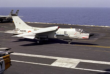 An F-8E(FN) landing aboard Dwight D. Eisenhower, 1983.