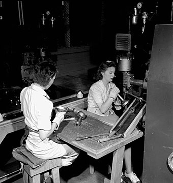 Female assembly workers during World War II. During the war, Canada became a major producer of war goods, particularly wheeled vehicles.