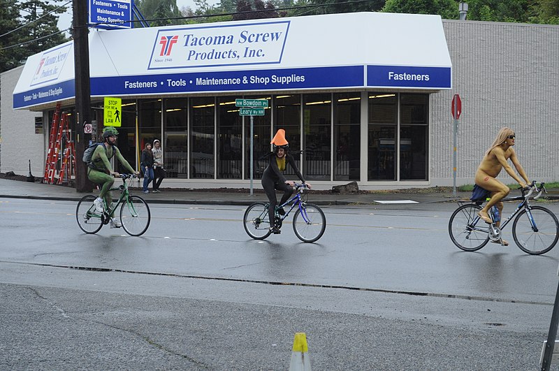 File:Fremont Solstice Parade 2011 - cyclists in front of Tacoma Screw.jpg