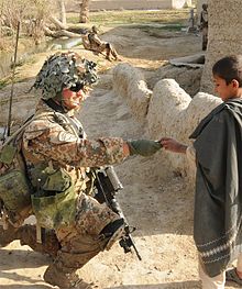A Danish Guard Hussar interacts with the local population in Helmand Province, Afghanistan GHR1.jpg