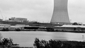 Construction photo from May 15, 1983 of the Plant A reactors and cooling tower from the south-west holding pond, facing north-east