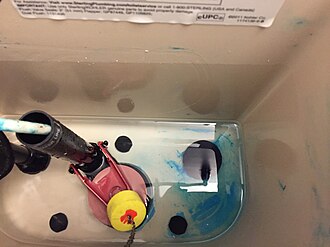 An In-Tank toilet cleaning tablet placed in toilet tank In Tank Toilet Cleaner Tablet Used.jpg