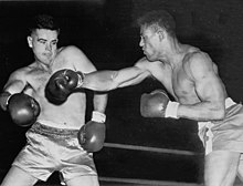 Ed Sanders (right) won Olympic gold in 1952, died of a brain injury in 1954 Jack Scheberies vs Ed Sanders 1952.jpg