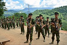 Cadets of the Kachin Independence Army (KIA) preparing for military drills at the group's headquarters in Laiza Kachin Independence Army cadets in Laiza (Paul Vrieze-VOA).jpg