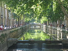 Les Quais de la Fontaine, the embankments of the spring that provided water for the city, the first civic gardens of France, were laid out in 1738–55.