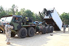 M1075A0 PLS with Oshkosh CHU.jpg