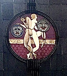 The comedy and tragedy medallion signals the use of the building. Medallion2021.jpg