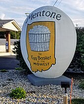 A 10-foot-tall concrete egg celebrating Mentone's egg production. Mentone Indiana concrete egg.jpg