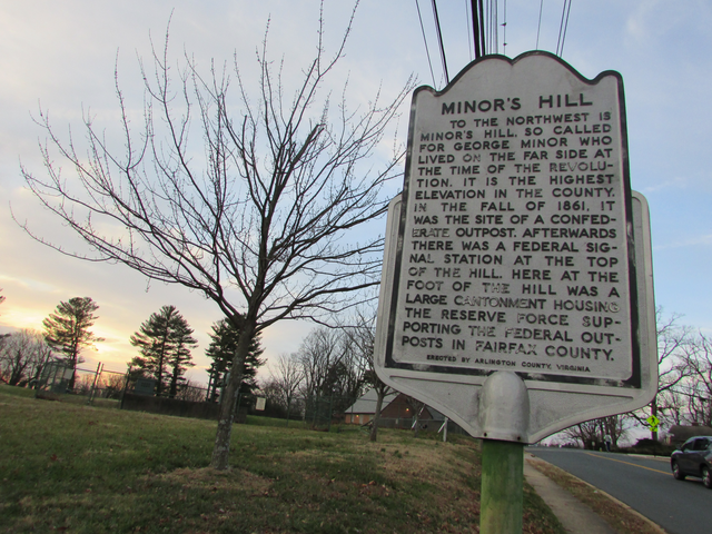 A historic marker located on top of the mostly flat summit of Minor's Hill.