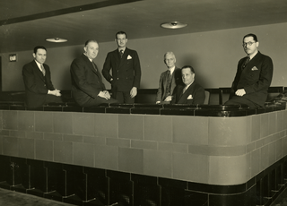 The architecture team for Kansas City's Municipal Auditorium. (L to R) William L. Cassell, Edwin M. Price, Homer F. Neville, Henry F. Hoit, Alonzo H. Gentry, Alfred E. Barnes. November, 1935. Folder 6; Alfred Edward Barnes (1892-1960) Municipal Auditorium Architecture Team (cropped).png