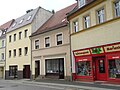 Residential house in closed development, later shop installation