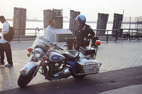 A Highway Patrol officer speaks with a passerby