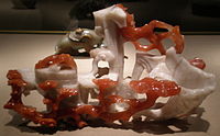 Ornament with persimmon, lily and ruyi fungus, chalcedony, 1900–49, Qing Dynasty or Republic Period. On display at the Asian Art Museum of San Francisco.
