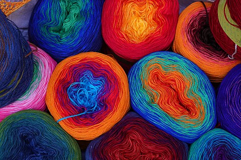 Rainbow yarn for knitting, display in front of a needlework shop in Graz, Austria