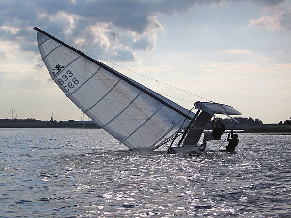 Righting a capsized Hobie Cat.