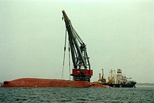 Soviet crane ship Stanislav Yudin rightening the capsized Finn-Baltic on 27 January 1991. Rightening of capsized Finn-Baltic (27 January 1991).jpg